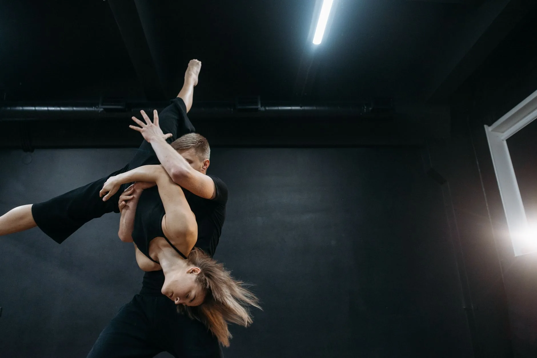 A soundstage with advanced equipment, bathed in natural light, showcasing arts and entertainment technologies.