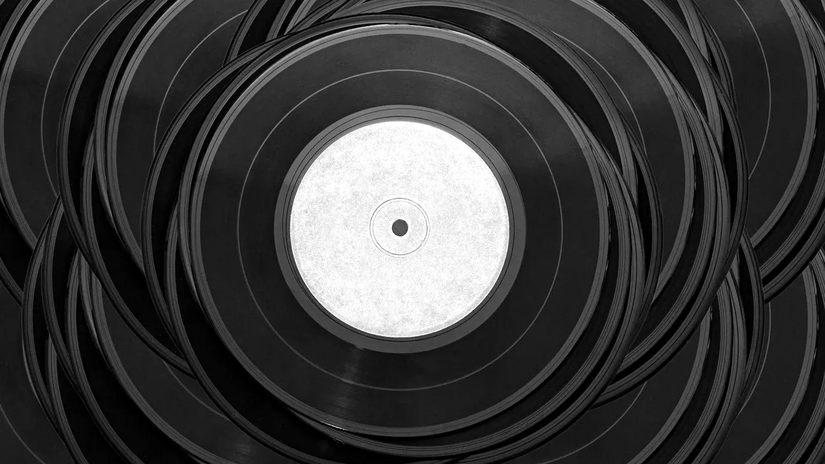 Records stacked on a shelf.